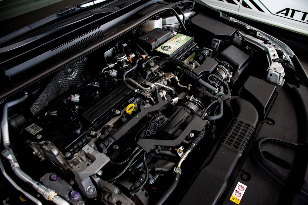 the-engine-compartment-of-a-car-with-its-hood-open-axxu0nvmgmk